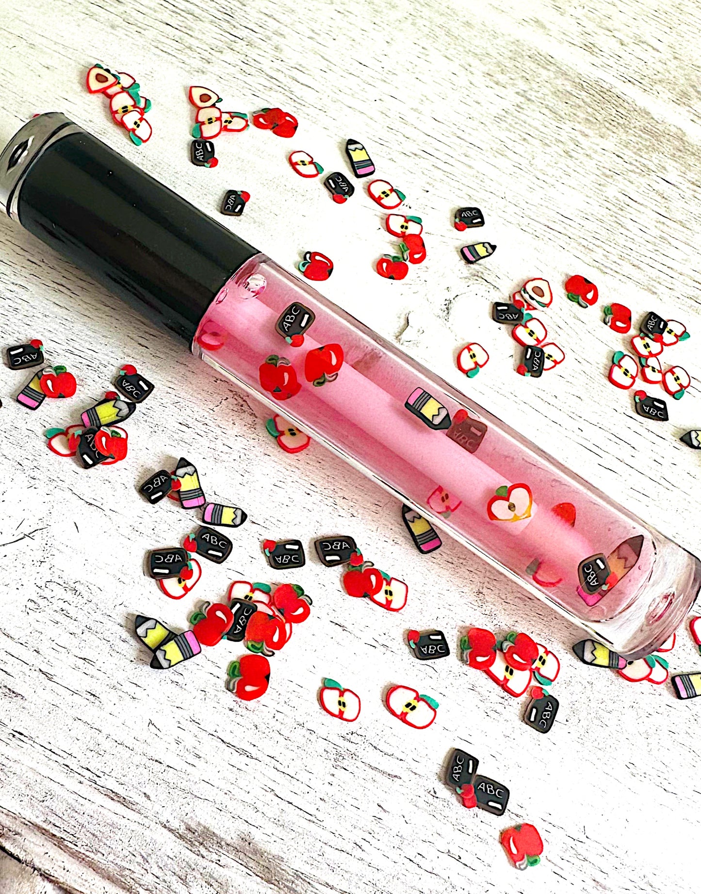Berry Smart Lip Gloss tube, mixed berry gloss with school-themed clay charms