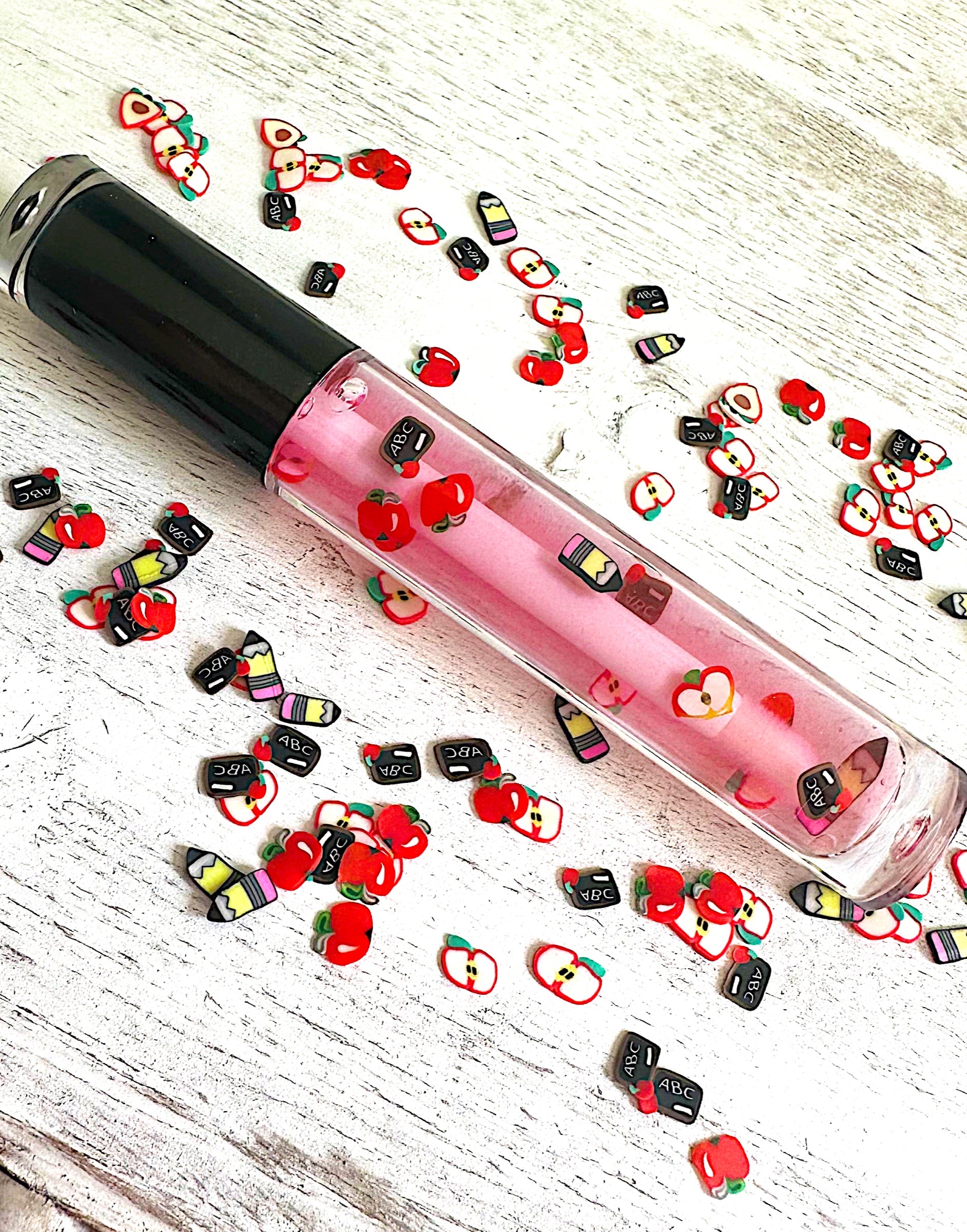 Berry Smart Lip Gloss tube, mixed berry gloss with school-themed clay charms